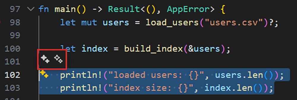 VS Code のエディタ内で、選択したコードの近くにインラインチャット起動用のアイコンが表示されている様子。